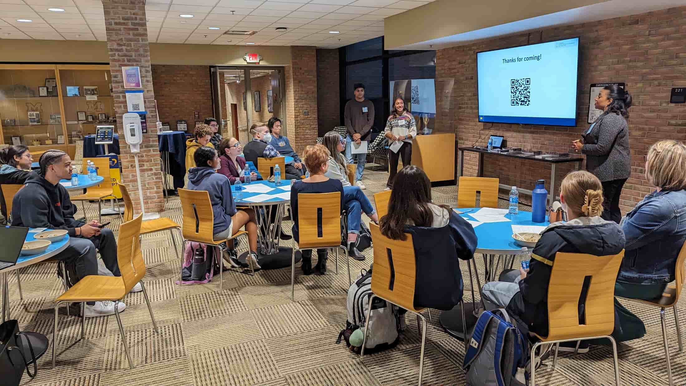 group of students listening to a presentation